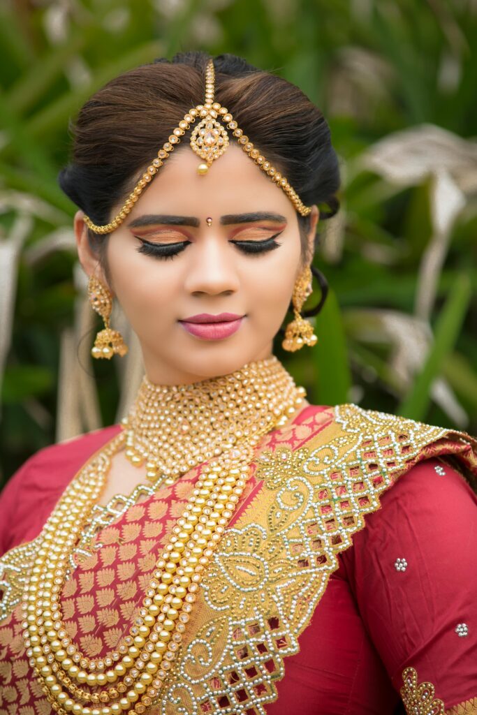 Beautiful Indian bride in embellished traditional attire during a photoshoot.